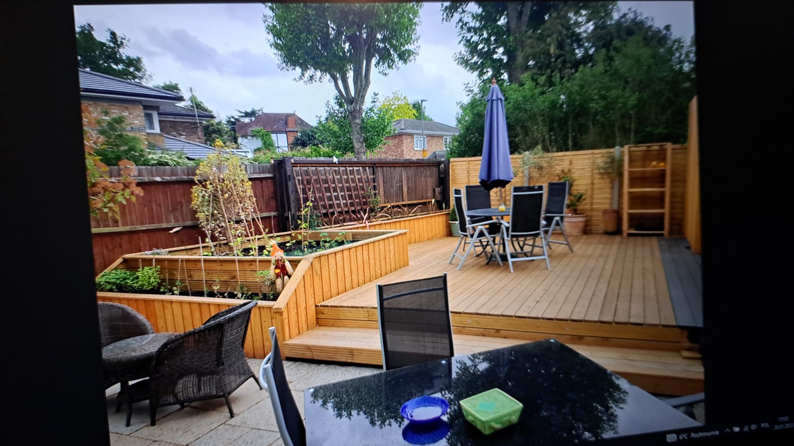 Patio seating area with garden features.