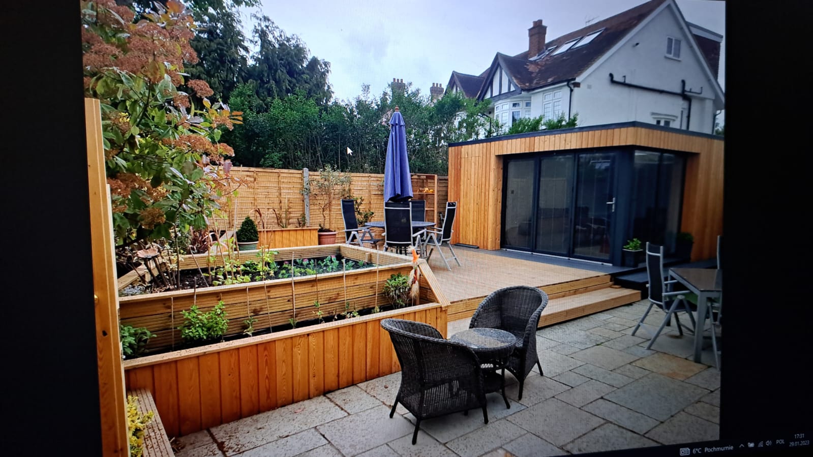 Patio seating area with fencing.